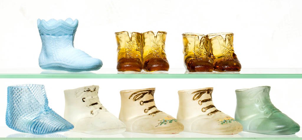 ASSORTED SHOE FIGURAL TOOTHPICK HOLDERS, LOT OF EIGHT: ASSORTED SHOE FIGURAL TOOTHPICK HOLDERS, LOT OF EIGHT, various colors, comprising six Bootie examples and two Two Shoes examples. Late 19th/early 20th century. 2" to 2 1/2" HOA. Provenance: The Lowell