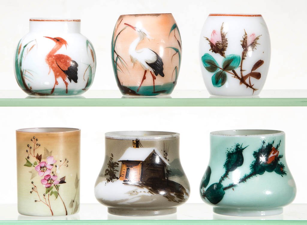 ASSORTED OPAQUE DECORATED TOOTHPICK HOLDERS, LOT OF SIX: ASSORTED OPAQUE DECORATED TOOTHPICK HOLDERS, LOT OF SIX, white with painted and polychrome decorations, including a Log Cabin in the Snow and two heron decorated examples, one barrel-form and one ball