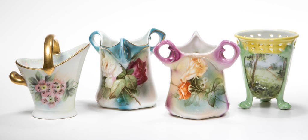 ROYAL BAYREUTH DECORATED PORCELAIN TOOTHPICK HOLDERS,: ROYAL BAYREUTH DECORATED PORCELAIN TOOTHPICK HOLDERS, LOT OF FOUR, including two three-handle examples with floral decoration. Each with printed blue mark to underside. Circa 1900-1920. 2 5/8" to 3" H