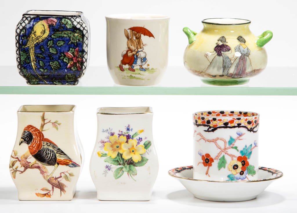 ASSORTED ROYAL DOULTON TOOTHPICK HOLDERS, LOT OF SIX: ASSORTED ROYAL DOULTON TOOTHPICK HOLDERS, LOT OF SIX, including Dutch figures, two with birds, one Spring, and one Bunnykins. First half 20th century. 1 3/4" to 2 1/2" H. Provenance: The Lowell Wiggin