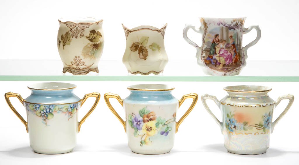 ASSORTED CONTINENTAL PORCELAIN TOOTHPICK HOLDERS, LOT: ASSORTED CONTINENTAL PORCELAIN TOOTHPICK HOLDERS, LOT OF SIX, comprising an E. S. Germany double-handle example with classical figures, Silesia Old Ivory XV and 84, and three double-handle KPM with ha