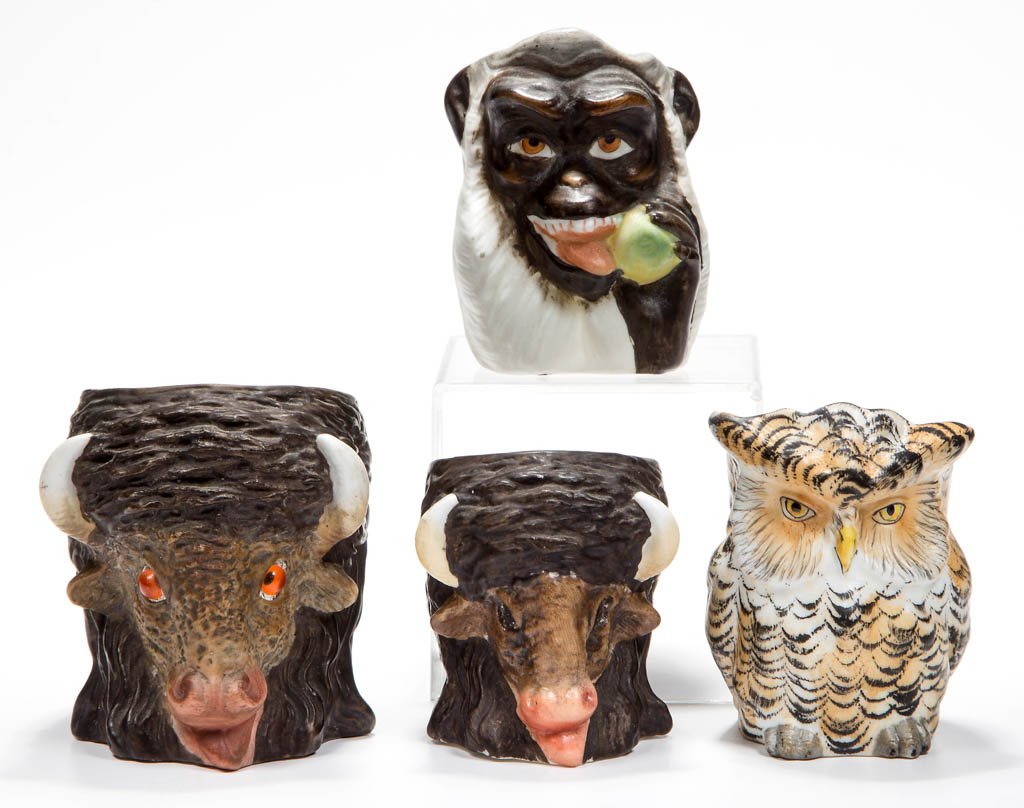 ASSORTED BISQUE FIGURAL ANIMAL TOOTHPICK HOLDERS, LOT: ASSORTED BISQUE FIGURAL ANIMAL TOOTHPICK HOLDERS, LOT OF FOUR, comprising two Buffalo, one large with applied eyes, a Monkey, and an Owl example. Late 19th/early 20th century. 2 1/4" to 2 7/8" H. Prov