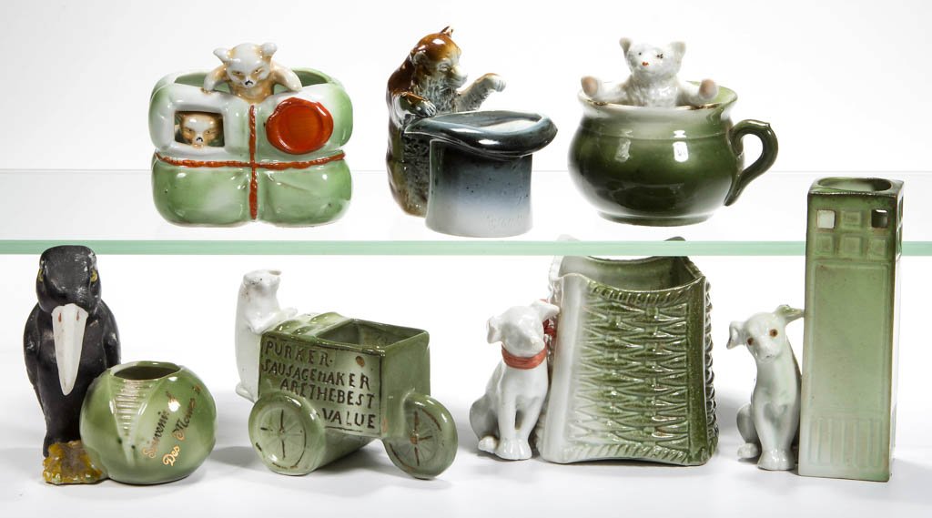 ASSORTED GERMAN ANIMAL FIGURAL CERAMIC TOOTHPICK /: ASSORTED GERMAN ANIMAL FIGURAL CERAMIC TOOTHPICK / MATCH HOLDERS, LOT OF SEVEN, comprising a pig, two dogs, two bears, and a crow. First quarter 20th century. 2 3/4" to 4 1/4" H. Provenance: The Lowel