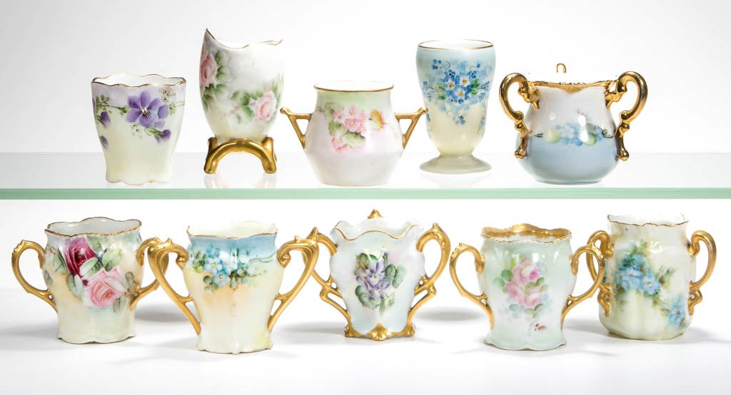 ASSORTED CONTINENTAL PORCELAIN TOOTHPICK HOLDERS, LOT: ASSORTED CONTINENTAL PORCELAIN TOOTHPICK HOLDERS, LOT OF TEN, including six with three handles, each with hand-painted floral decoration, markings include Germany, Austria, and Bavaria. First quarter