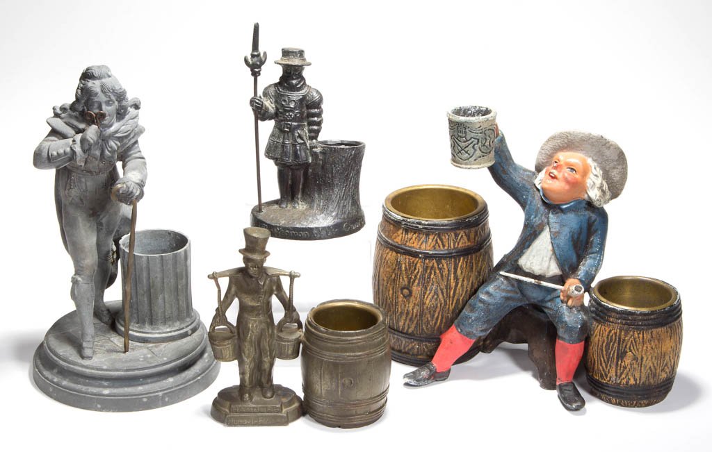ASSORTED METAL FIGURAL TOOTHPICK / MATCH HOLDERS, LOT: ASSORTED METAL FIGURAL TOOTHPICK / MATCH HOLDERS, LOT OF FOUR, including a cold-painted smoking set and a large example marked "LSF" under base. Fourth quarter 19th/first quarter 20th century. 4 1/2"