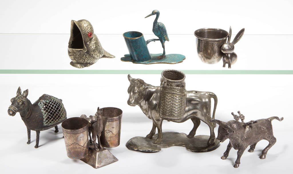 ASSORTED SILVER AND OTHER METAL FIGURAL ANIMAL: ASSORTED SILVER AND OTHER METAL FIGURAL ANIMAL TOOTHPICK HOLDERS, LOT OF SEVEN, including a sterling silver Mexican bull, Peruvian llama, and German long-eared rabbit. Silver weight: 7.485 ozt. 20th c