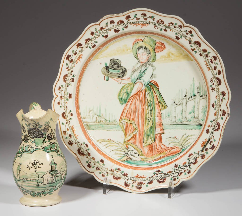 ENGLISH STAFFORDSHIRE POTTERY CREAMWARE DUTCH-DECORATED: ENGLISH STAFFORDSHIRE POTTERY CREAMWARE DUTCH-DECORATED ITEMS, LOT OF TWO, comprising a scalloped, lobed, press-molded plate, the rim painted in iron-red, green and grey with an undulating vine betwee