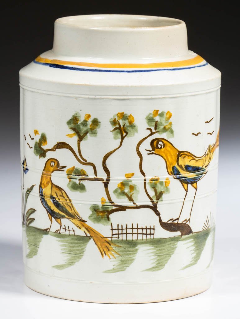 ENGLISH STAFFORDSHIRE POTTERY PEARLWARE PEAFOWL TEA: ENGLISH STAFFORDSHIRE POTTERY PEARLWARE PEAFOWL TEA CANISTER, of fluted and band-molded cylindrical form, painted with a series of scenes of avian interest, with yellow, orange and blue birds among br