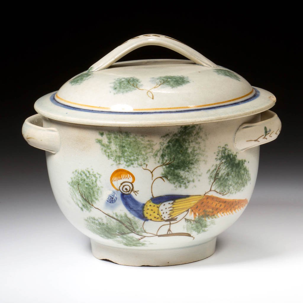 ENGLISH STAFFORDSHIRE POTTERY PEARLWARE PEAFOWL SUGAR: ENGLISH STAFFORDSHIRE POTTERY PEARLWARE PEAFOWL SUGAR BOWL AND COVER, with grooved strap handles to the sides and cover, the body painted to front and back with a colorful peafowl on brown branches su