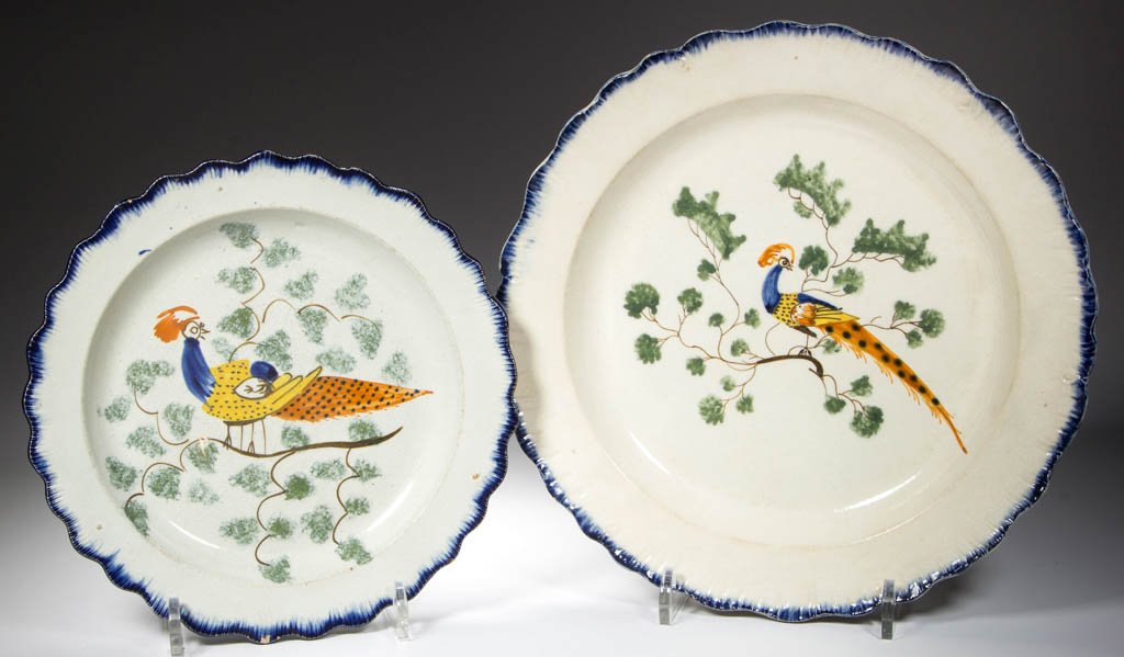 ENGLISH STAFFORDSHIRE POTTERY PEARLWARE PEAFOWL PLATES,: ENGLISH STAFFORDSHIRE POTTERY PEARLWARE PEAFOWL PLATES, LOT OF TWO, with press-molded scallop-shell rim, painted with a band of cobalt blue to the edge, the face painted with a long-tailed peafowl nes