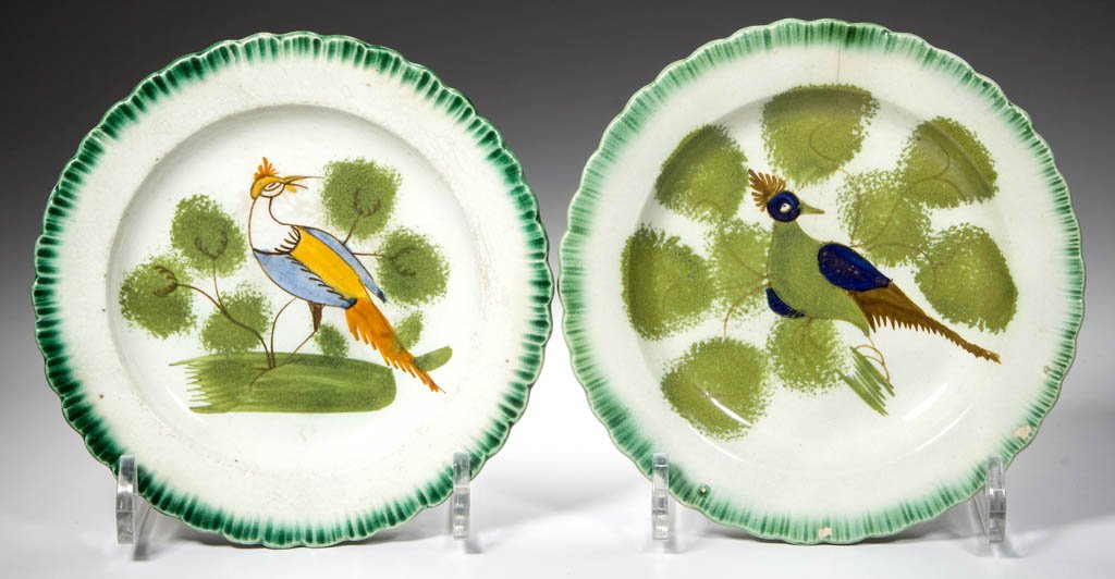ENGLISH STAFFORDSHIRE POTTERY PEARLWARE PEAFOWL PLATES,: ENGLISH STAFFORDSHIRE POTTERY PEARLWARE PEAFOWL PLATES, LOT OF TWO, nappy dishes, with press-molded scallop-shell rims, painted with green bands to the rim, each centering a peafowl among curling brow