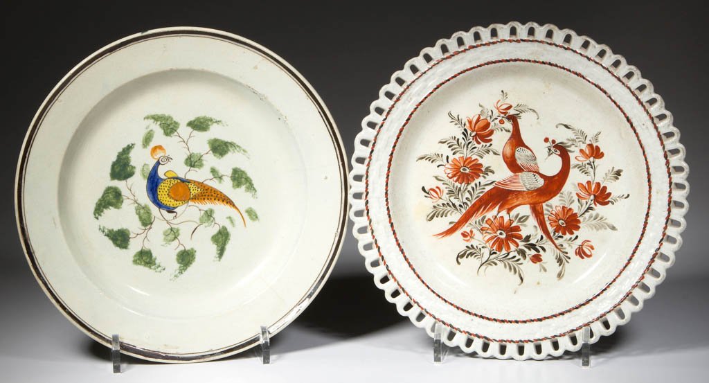 BRITISH POTTERY PEARLWARE PEAFOWL PLATES, LOT OF TWO: BRITISH POTTERY PEARLWARE PEAFOWL PLATES, LOT OF TWO, comprising a Swansea-area Cambrian Pottery arcaded basket-woven plate painted with alternating bands of red and black dashes designed to appear as