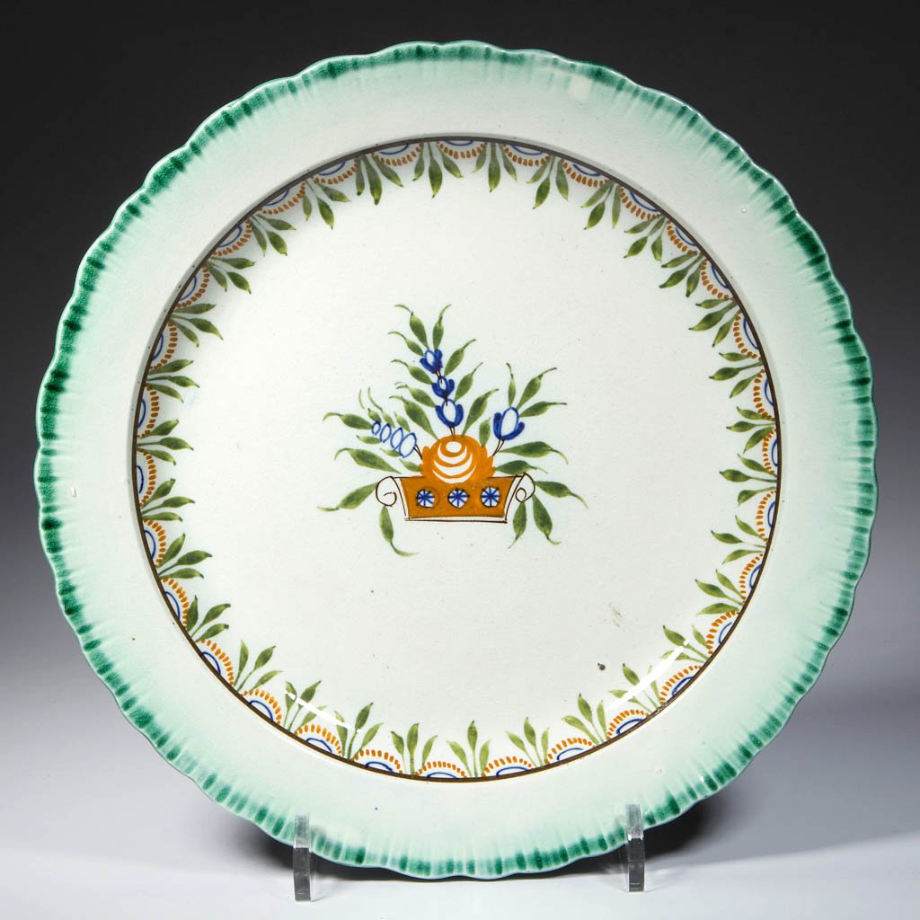 ENGLISH STAFFORDSHIRE POTTERY PEARLWARE: ENGLISH STAFFORDSHIRE POTTERY PEARLWARE BASKET-OF-FLOWERS PLATE, of scallop-shell molded form, painted with a green band to the edge, with a brown band to the inner edge, issuing a border pattern of s