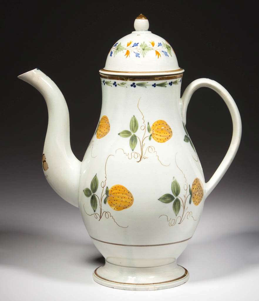 ENGLISH STAFFORDSHIRE POTTERY PEARLWARE COFFEE POT AND: ENGLISH STAFFORDSHIRE POTTERY PEARLWARE COFFEE POT AND ASSOCIATED COVER, of baluster form, painted in typical Prattware hues with foliate bands and stylized berries the spout and handle painted with t