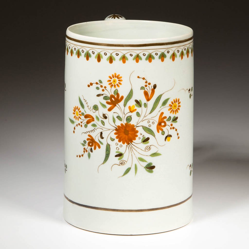 ENGLISH STAFFORDSHIRE POTTERY PEARLWARE TALL TANKARD OR: ENGLISH STAFFORDSHIRE POTTERY PEARLWARE TALL TANKARD OR CIDER MUG, of straight-sided, lightly-flaring form, painted in typical Prattware hues with brown lines bracketing a floral band over large flora