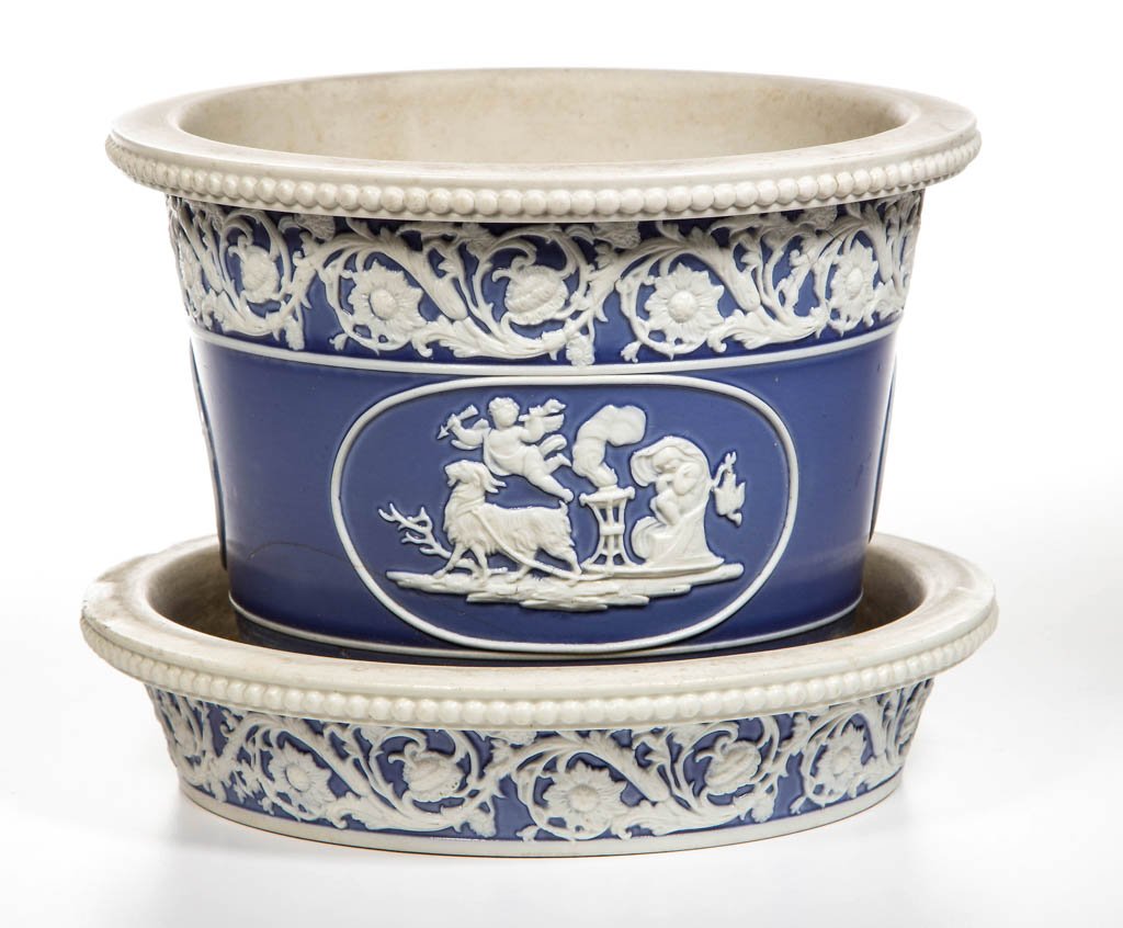 ENGLISH STAFFORDSHIRE POTTERY SMEAR-GLAZED STONEWARE: ENGLISH STAFFORDSHIRE POTTERY SMEAR-GLAZED STONEWARE FLOWER POT AND STAND, of tapering straight-sided, cylindrical form, with shouldered upper rim, molded with beading to the edge, the body and stand 