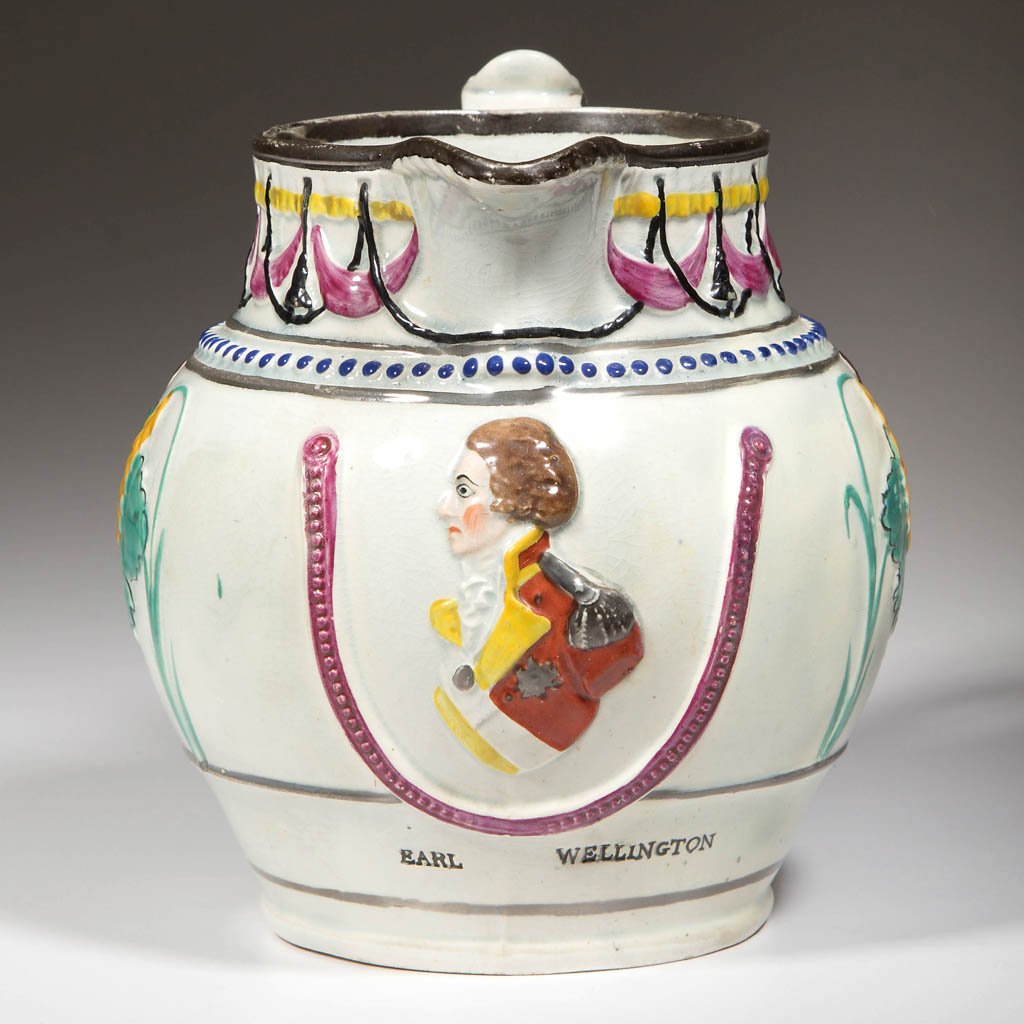 ENGLISH STAFFORDSHIRE POTTERY PEARLWARE PRATTWARE: ENGLISH STAFFORDSHIRE POTTERY PEARLWARE PRATTWARE MOLDED COMMEMORATIVE PITCHER, of globular form, the wide handle with foliate-molded upper section, the body molded with swags of curtains and fringe o
