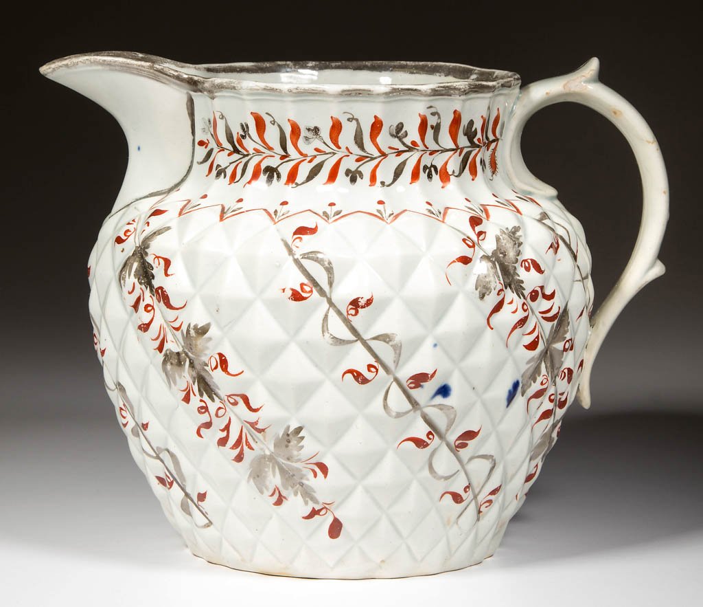 ENGLISH STAFFORDSHIRE POTTERY PEARLWARE SILVER LUSTER: ENGLISH STAFFORDSHIRE POTTERY PEARLWARE SILVER LUSTER PINEAPPLE MOLDED PITCHER, of Dutch shape, with broad handle and ribbed neck, silver luster rim and foliate designs in iron-red and silver luster i