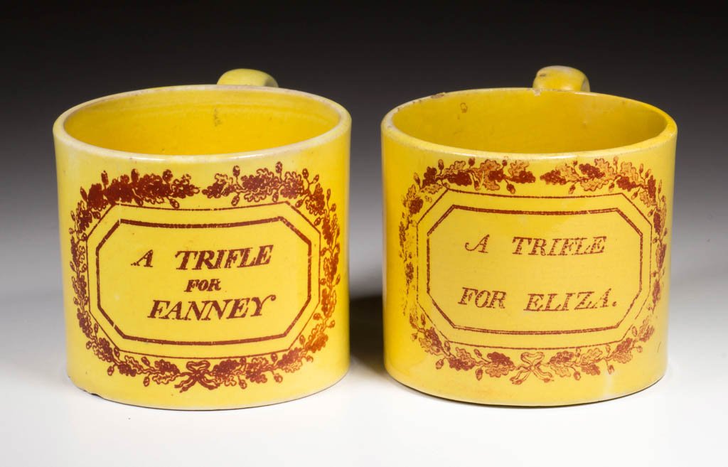 ENGLISH STAFFORDSHIRE OR YORKSHIRE POTTERY CANARY: ENGLISH STAFFORDSHIRE OR YORKSHIRE POTTERY CANARY YELLOW-GLAZED CHILD'S MUGS, LOT OF TWO, comprising two straight-sided mugs, each transfer-printed in iron-red, the first with "A TRIFLE FOR ELIZA," th