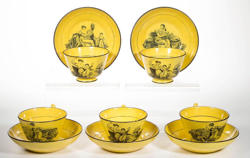 ENGLISH STAFFORDSHIRE POTTERY PEARLWARE CANARY YELLOW: ENGLISH STAFFORDSHIRE POTTERY PEARLWARE CANARY YELLOW TEAWARES, LOT OF 10, comprising five cup and saucer sets, the cups with London-shaped handles, all with black outlines to rims and handles bat-pri
