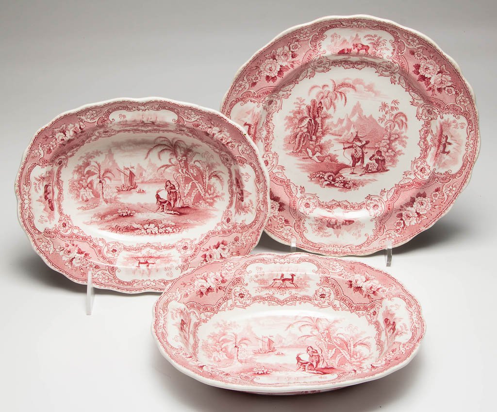 ENGLISH ADAMS POTTERY PEARLWARE "LANDING OF COLUMBUS": ENGLISH ADAMS POTTERY PEARLWARE "LANDING OF COLUMBUS" PATTERN ARTICLES, LOT OF THREE, red transfer-printed articles, comprising a dinner plate and two open oval vegetable bowls, of scalloped form, wit