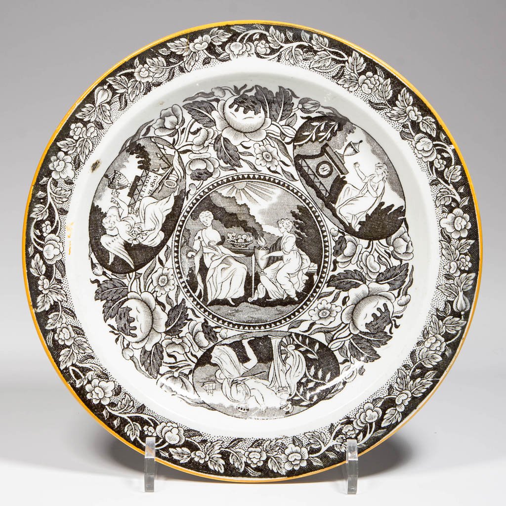 ENGLISH STAFFORDSHIRE POTTERY PEARLWARE "NELSON": ENGLISH STAFFORDSHIRE POTTERY PEARLWARE "NELSON" PATTERN COMMEMORATIVE PLATE, transfer-printed in black with a vining band of floral and botanical interest within an ocher edge, centering the face, pr