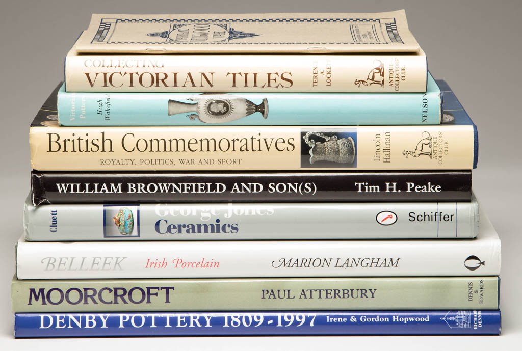 ASSORTED POTTERY REFERENCE VOLUMES, LOT OF NINE: ASSORTED POTTERY REFERENCE VOLUMES, LOT OF NINE, including Tim H. Peake, "William Brownfield and Son(s): An Illustrated Guide to Brownfield Wares 1837-1900," with applied label to cover page signed by