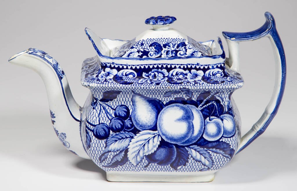 ENGLISH STAFFORDSHIRE POTTERY PEARLWARE "APRICOTS AND: ENGLISH STAFFORDSHIRE POTTERY PEARLWARE "APRICOTS AND CHERRIES" PATTERN TEAPOT AND COVER, of oblong "cottage" form, transfer-printed with a pattern of basket weave surrounding leaves, cherries and apr