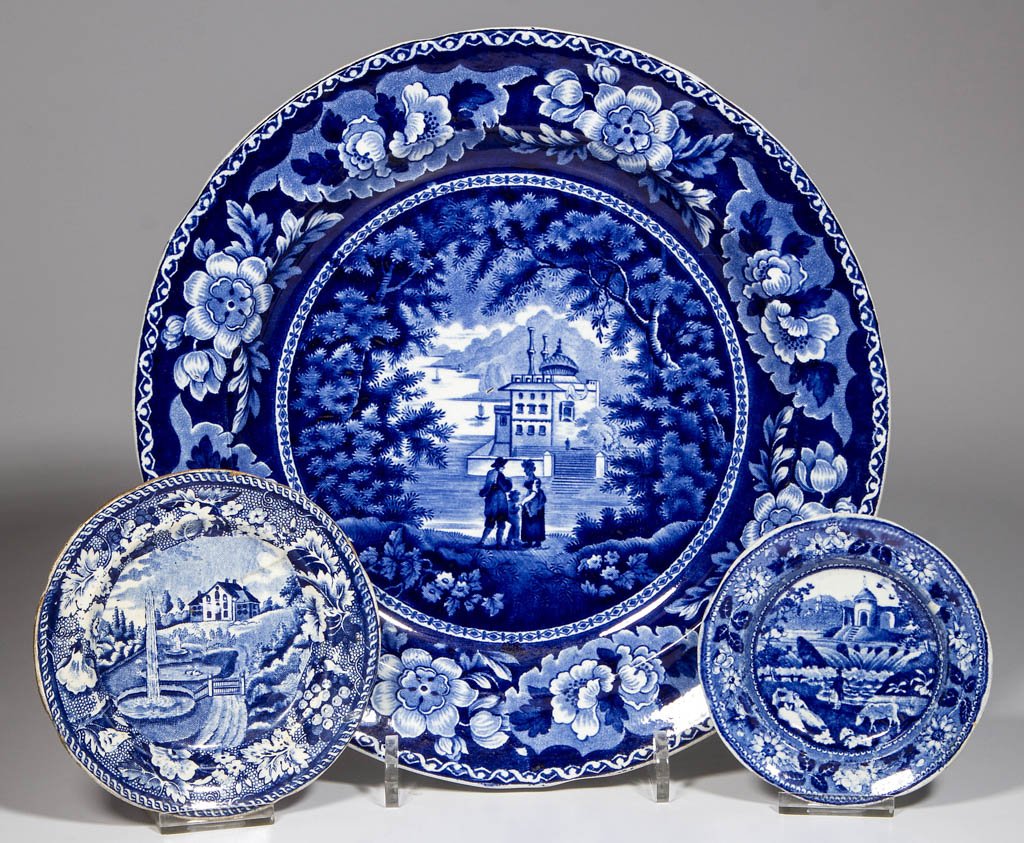 ENGLISH STAFFORDSHIRE POTTERY PEARLWARE: ENGLISH STAFFORDSHIRE POTTERY PEARLWARE TRANSFER-PRINTED PLATES, LOT OF THREE, comprising a dinner plate printed with a bold floral and foliate reserve border framing a romantic view; a toddy plate wi