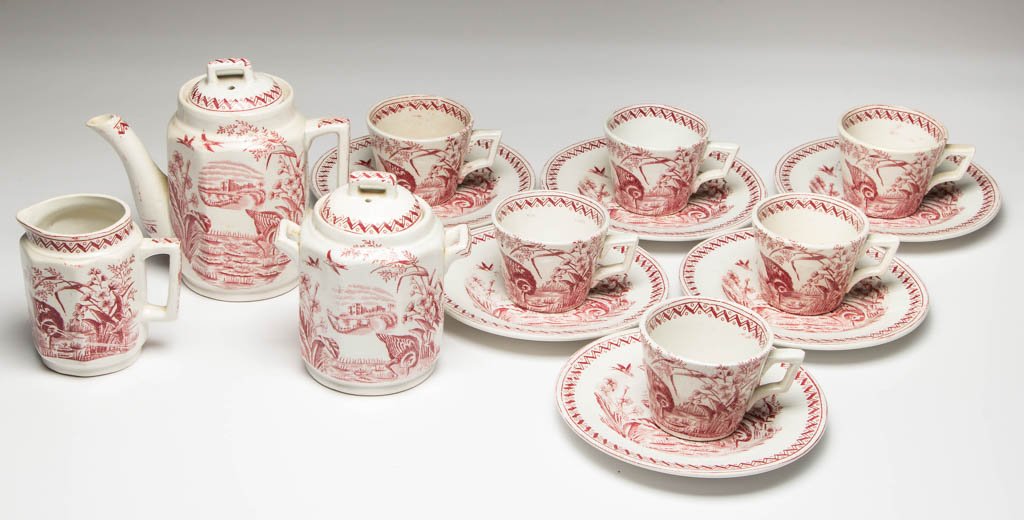 ENGLISH C. ALLERTON & SONS POTTERY CHILD'S IRONSTONE: ENGLISH C. ALLERTON & SONS POTTERY CHILD'S IRONSTONE TEA SET, LOT OF FIFTEEN, transfer-printed in red, comprising a teapot and cover, a sugar and cover, a creamer, and six cups and saucers; the servin