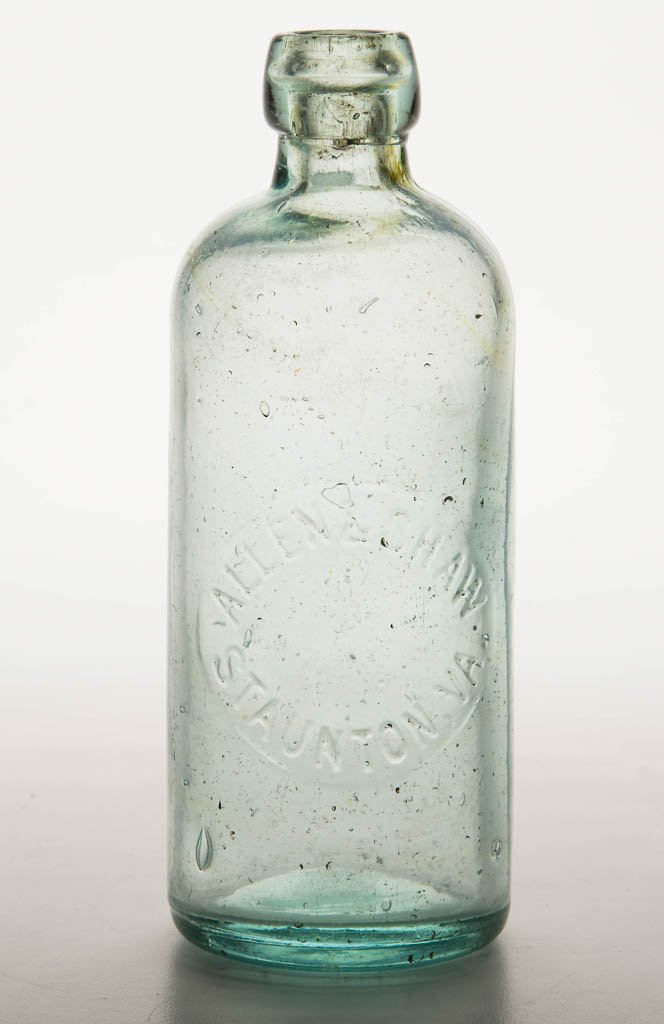 STAUNTON, VIRGINIA SODA BOTTLE: STAUNTON, VIRGINIA SODA BOTTLE, light green, embossed "ALLEN & SHAW / STAUNTON, VA.", applied rounded mouth. Fourth quarter 19th century. 6 1/2" H. Provenance: Property of a Virginia private collector