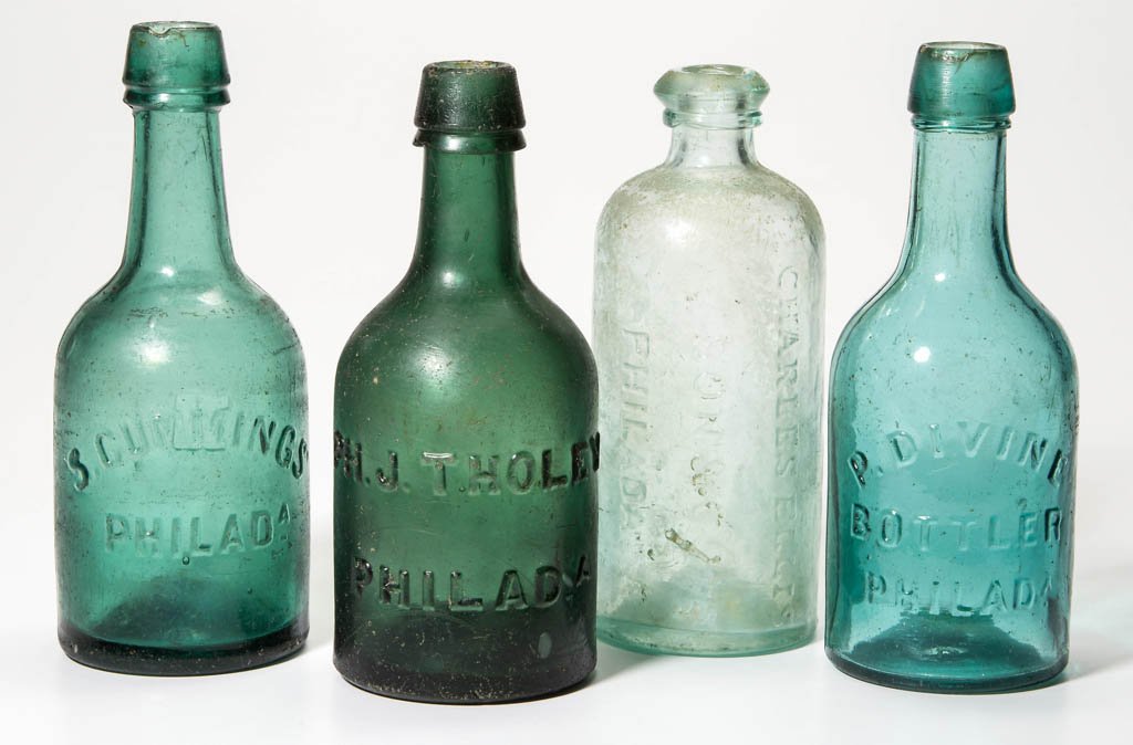 ASSORTED PHILADELPHIA, PA SODA BOTTLES, LOT OF FOUR: ASSORTED PHILADELPHIA, PA SODA BOTTLES, LOT OF FOUR, aqua, teal, green, and emerald green, with embossed lettering, comprising "P. DIVINE / BOTTLER / PHILAD.", "S. CUMMINGS / PHILAD.A.", and "PH. J. T
