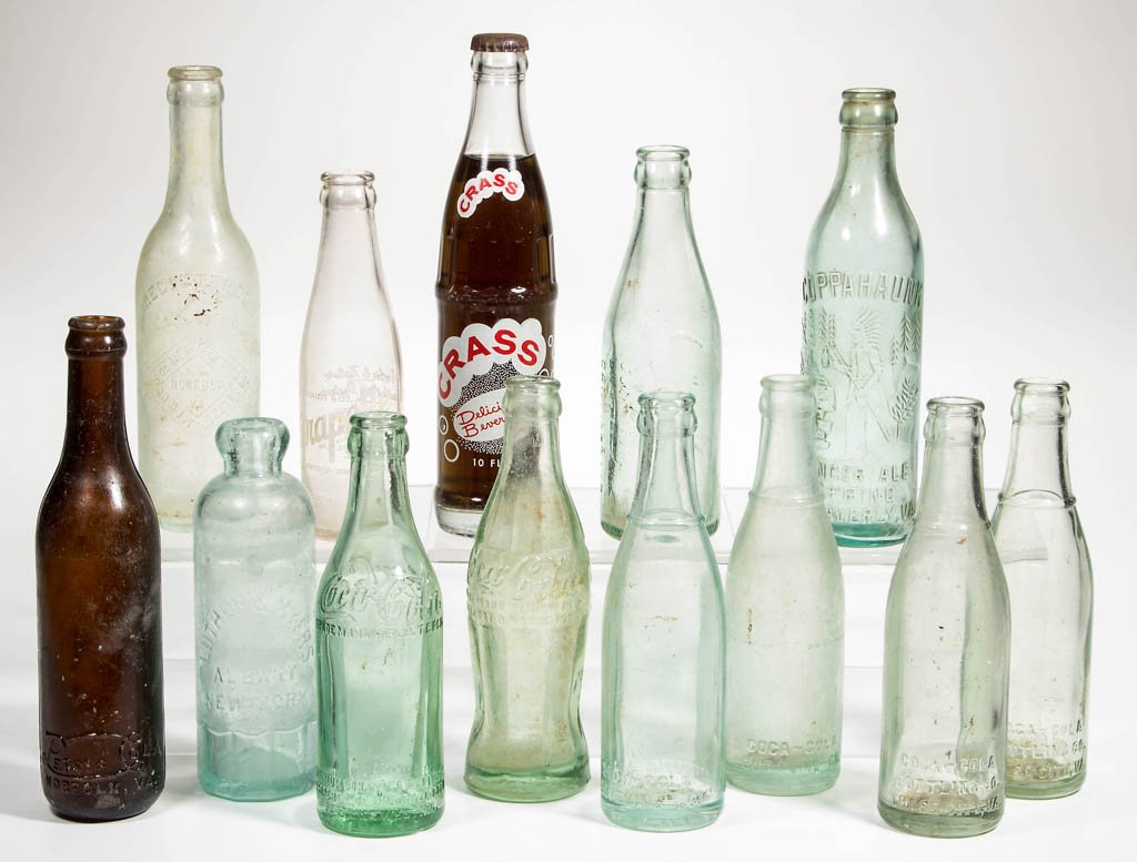 ASSORTED COCA-COLA, PEPSI-COLA, AND OTHER SODA BOTTLES,: ASSORTED COCA-COLA, PEPSI-COLA, AND OTHER SODA BOTTLES, LOT OF 13, including an amber Norfolk, VA Pepsi-Cola example, an Emporia, VA Coca-Cola example with script logo to each shoulder and under base,
