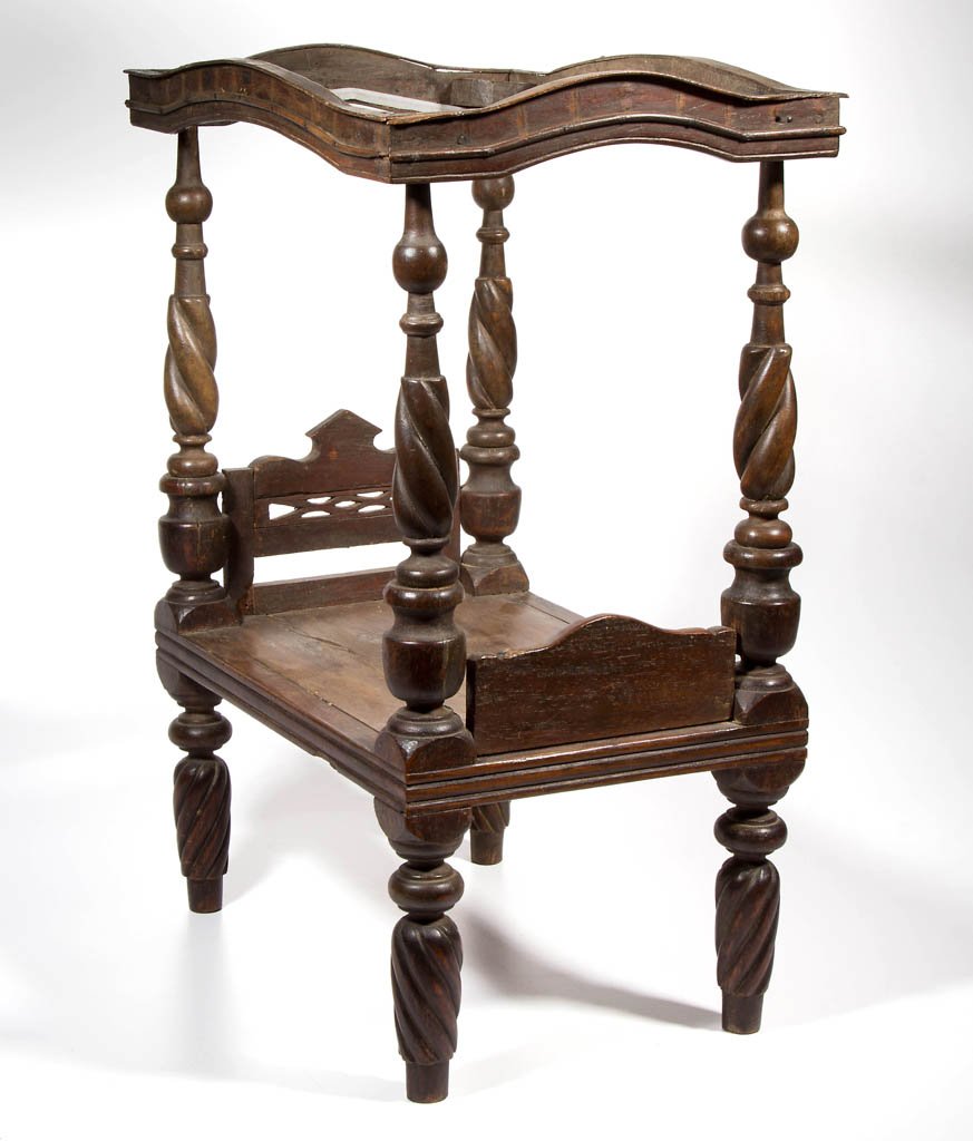 CARVED AND TURNED MAHOGANY POSTER DOLL BED: CARVED AND TURNED MAHOGANY POSTER DOLL BED, spiral-turned posts and legs, with canopy top. 19th/20th century. 22 3/4" H, 11 1/4" x 16 1/4".
