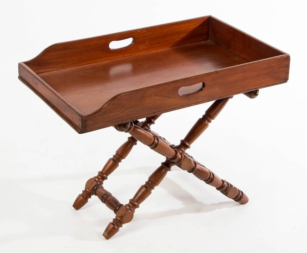 ENGLISH MAHOGANY BUTLER'S TRAY AND STAND: ENGLISH MAHOGANY BUTLER'S TRAY AND STAND, the period (early 19th century) dovetailed tray with cut-out hand holds, the folding stand with ringed baluster turnings. Each with old surface and warm color