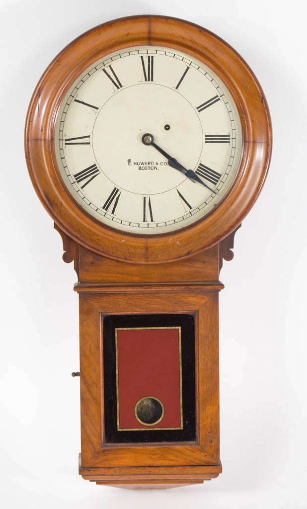 E. HOWARD WALL CLOCK: E. HOWARD WALL CLOCK, model No. 70, having 12 1/2 inch dial marked "E. Howard & Co. / Boston", reverse-painted tablet, and mahogany case. Mid 19th century. 31" HOA, 15 1/2" WOA, 4 3/4" DOA.Provenance: