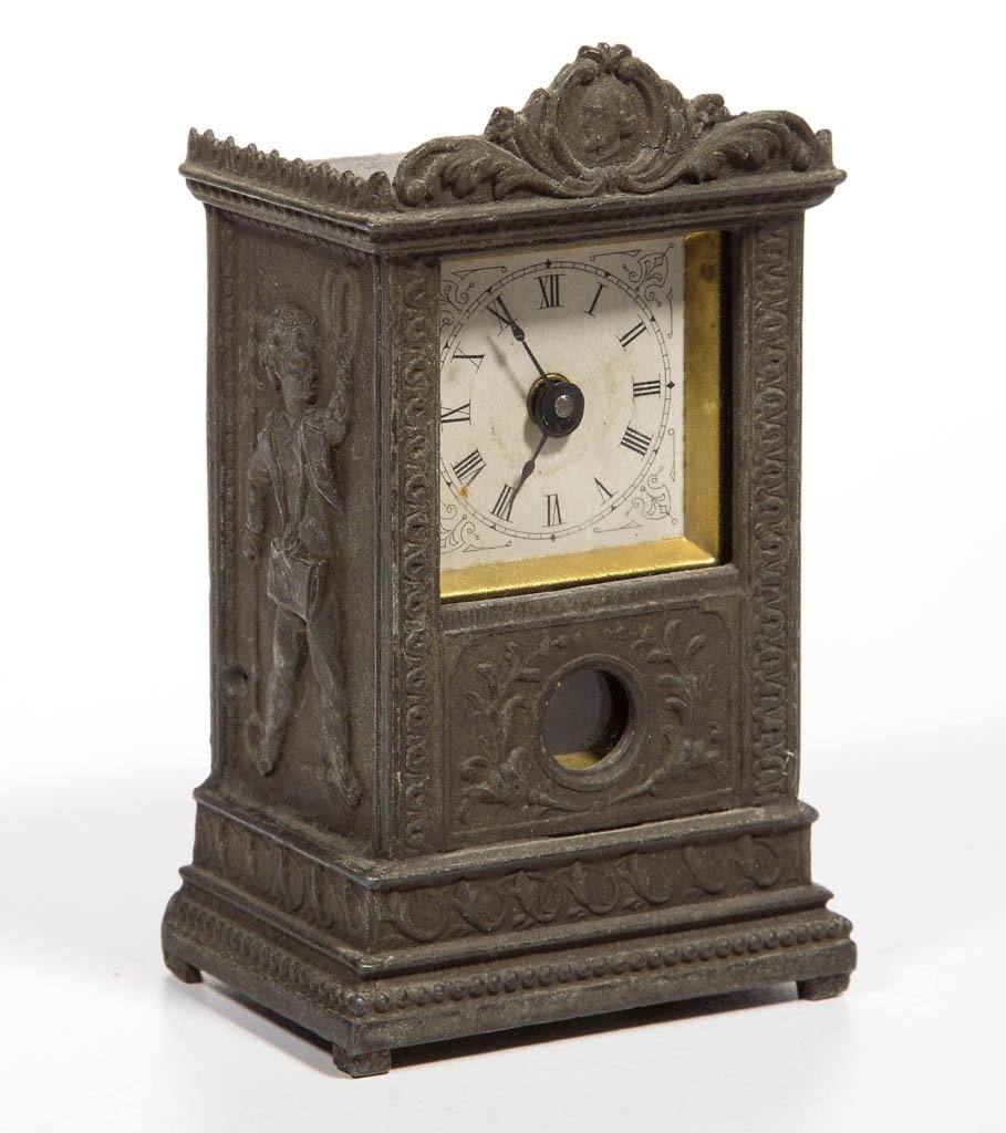 YALE CLOCK CO., NEW HAVEN, CT MINIATURE MANTLE CLOCK: YALE CLOCK CO., NEW HAVEN, CT MINIATURE MANTLE CLOCK, original cast-metal case, keywind, attached pendulum, various 1881 patent dates on reverse. Fourth quarter 19th century. 4 1/2" H, 2 3/4" x 1 7/8"