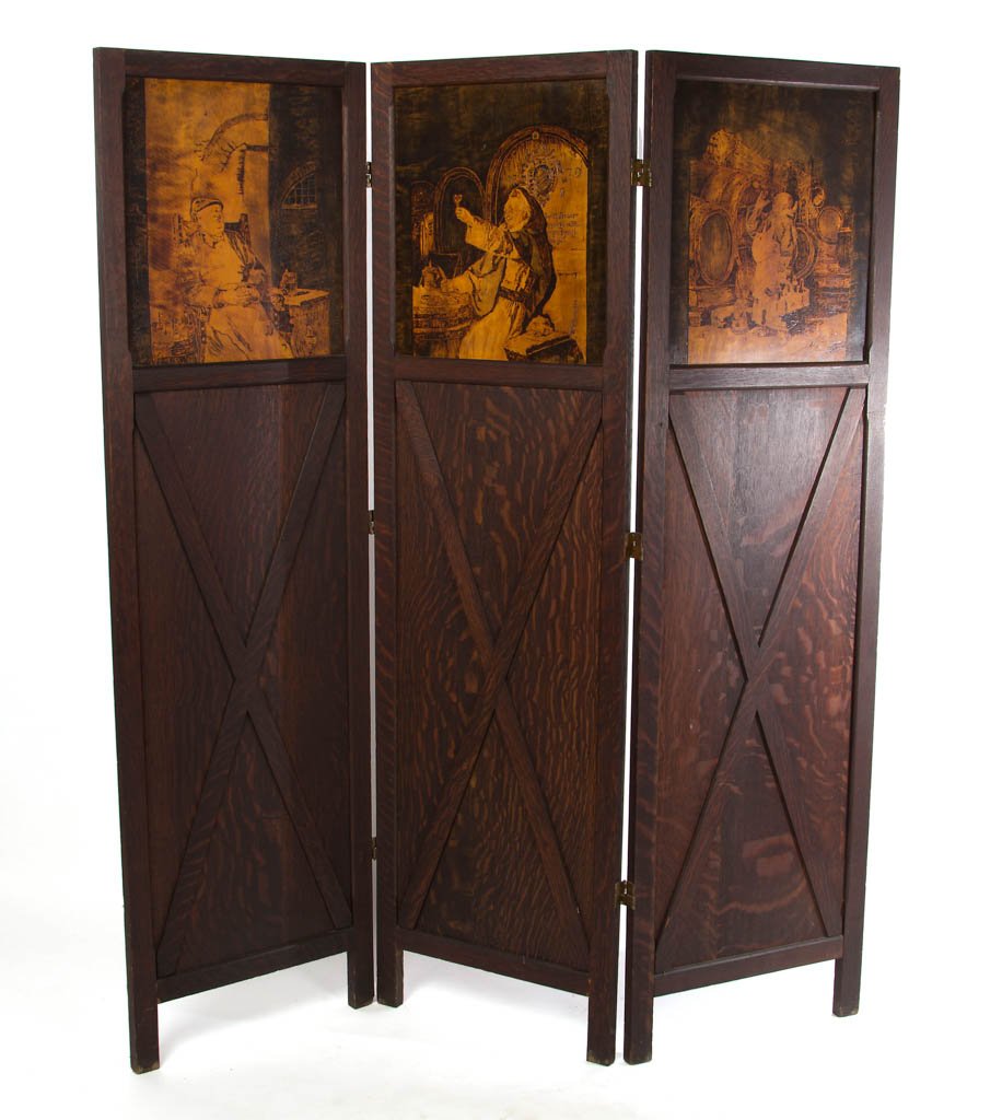 AMERICAN OAK ARTS AND CRAFTS THREE-PANEL DRESSING: AMERICAN OAK ARTS AND CRAFTS THREE-PANEL DRESSING SCREEN, quarter-sawn, featuring pyrographic decoration depicting drinking monks. Center panel inscribed with signature and date "1882". Original brass