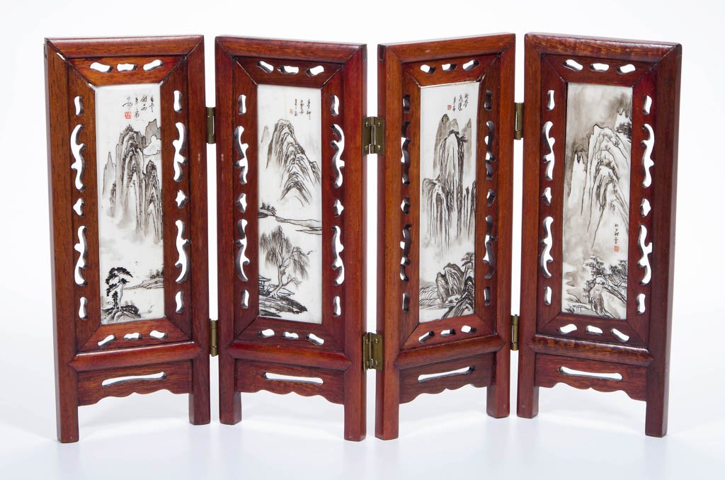 CHINESE SCRIMSHAW AND ROSEWOOD FOLDING TABLE SCREEN: CHINESE SCRIMSHAW AND ROSEWOOD FOLDING TABLE SCREEN, of four sections, each with carved rosewood frame inset with scrimshaw panel, one side with mountainous landscapes, the other with a woman charming