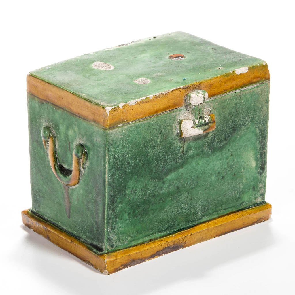 CHINESE POTTERY FUNERARY BOX: CHINESE POTTERY FUNERARY BOX, green and ochre glaze, in the form of a double handled chest on flat base, with molded latch and hinges, cut opening to underside, as made; four incised marks to interior