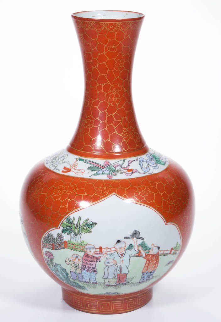 CHINESE PORCELAIN BOTTLE VASE: CHINESE PORCELAIN BOTTLE VASE, of slightly baluster form, on squared foot, with coral red over-glaze having gold painted irregular geometric pattern and stylized floral blossoms all over, divided at s