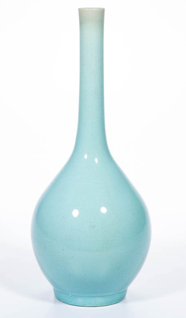 CHINESE PORCELAIN BOTTLE VASE: CHINESE PORCELAIN BOTTLE VASE, the slightly bulbous body on low foot, tapering to a narrow, straight neck with very slightly flared rim; pale aqua or robin's egg blue glaze, yellowing slightly toward 
