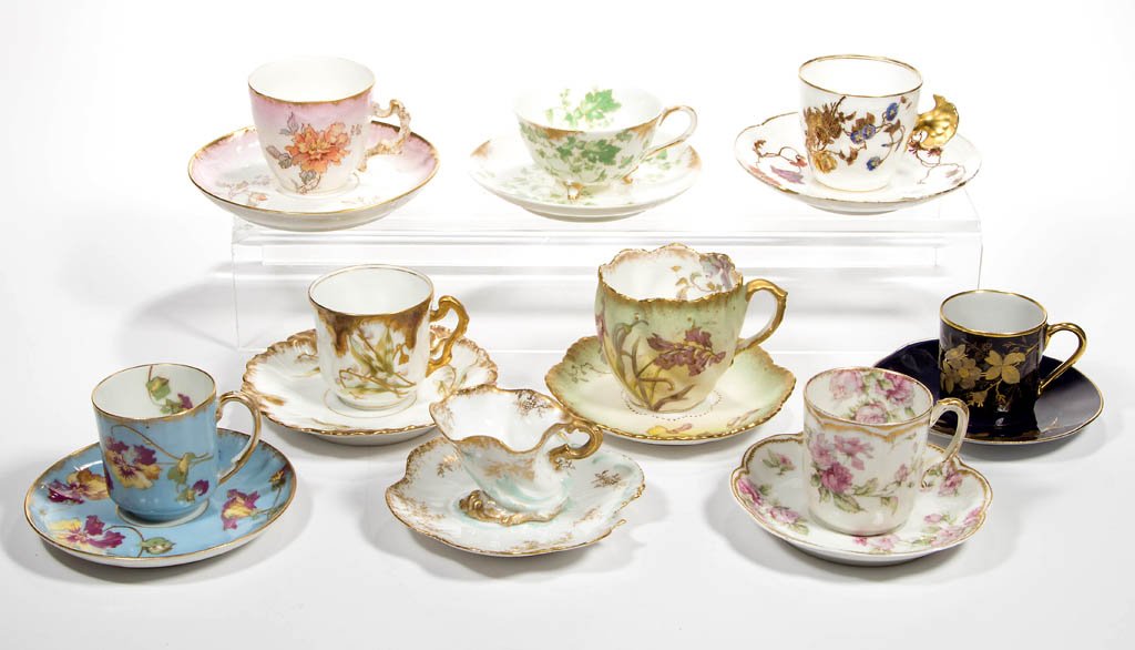 ASSORTED LIMOGES, FRANCE PORCELAIN DEMITASSE CUP AND: ASSORTED LIMOGES, FRANCE PORCELAIN DEMITASSE CUP AND SAUCER SETS, LOT OF NINE, floral decorated, including a red J. Pouyat and a Elite S. M. mark, a blue A. Lanternier mark, and various others. Late 1