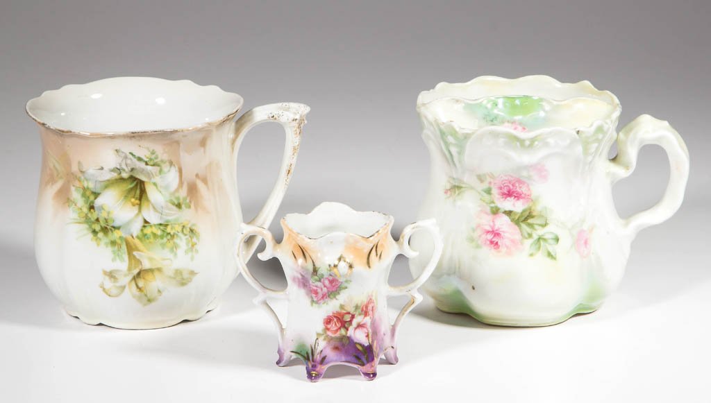 GERMAN R. S. PRUSSIA ARTICLES, LOT OF THREE: GERMAN R. S. PRUSSIA ARTICLES, LOT OF THREE, comprising a mug with lily bouquet decoration, a shaving mug with rose spray decoration, and a double-handled toothpick holder with rose bouquet decoration