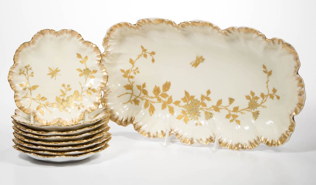 LIMOGES, FRANCE PORCELAIN TRESSEMAGNE & VOGT: LIMOGES, FRANCE PORCELAIN TRESSEMAGNE & VOGT IVORY-GROUND ICE-CREAM SET, comprising a rectangular serving bowl and eight dessert plates, all with scallop-molded rims, painted with powdered gold bands