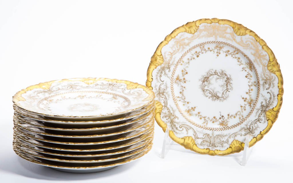 THEODORE HAVILAND, LIMOGES, FRANCE PORCELAIN BREAD &: THEODORE HAVILAND, LIMOGES, FRANCE PORCELAIN BREAD & BUTTER PLATES, SET OF 10, each scallop-molded plate with gilt rims over gold-dusted yellow border, above a band of gold-dusted gilt scrolls and fol