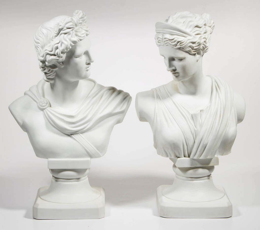 PARIAN-STYLE PORCELAIN PAIR OF BUSTS: PARIAN-STYLE PORCELAIN PAIR OF BUSTS, depicting a Classical-style male and female, each bolted to a socle/plinth. Marked only with "23/402" in red under bases. Second half 20th century. 16 1/2" HOA.