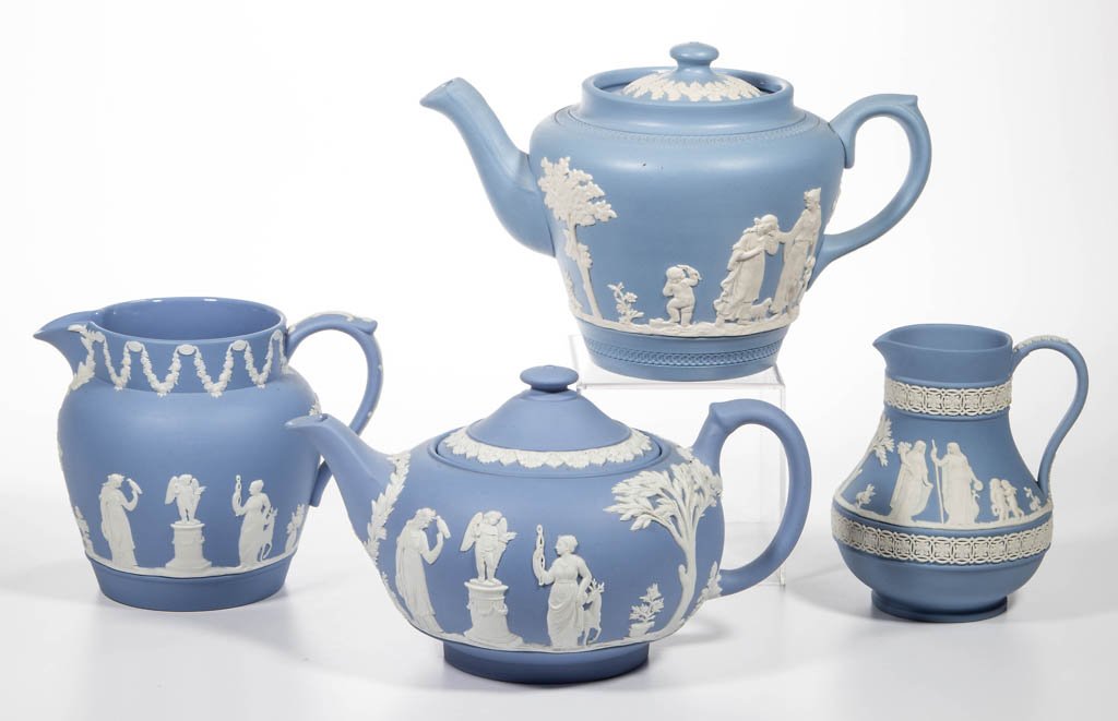 WEDGWOOD JASPERWARE TABLE ARTICLES, LOT OF THREE: WEDGWOOD JASPERWARE TABLE ARTICLES, LOT OF THREE, comprising a teapot and two creamers of different form; all with applied Neoclassical figures, and impressed marks to underside. Together with a Dudso