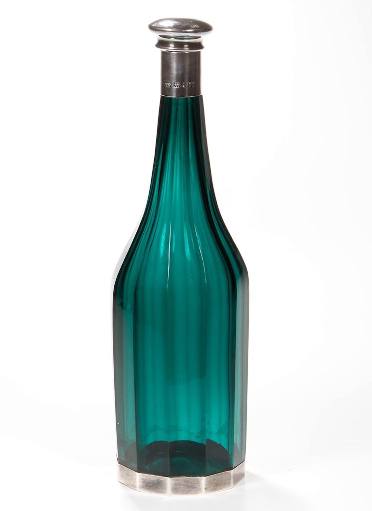ENGLISH SILVER AND CUT GLASS DECANTER: ENGLISH SILVER AND CUT GLASS DECANTER, deep emerald green, 12-panel bottle with silver mounted mouth and base, and original silver stopper. Each marked for Sheffield, 1838, and John Watson & Son. (UPD