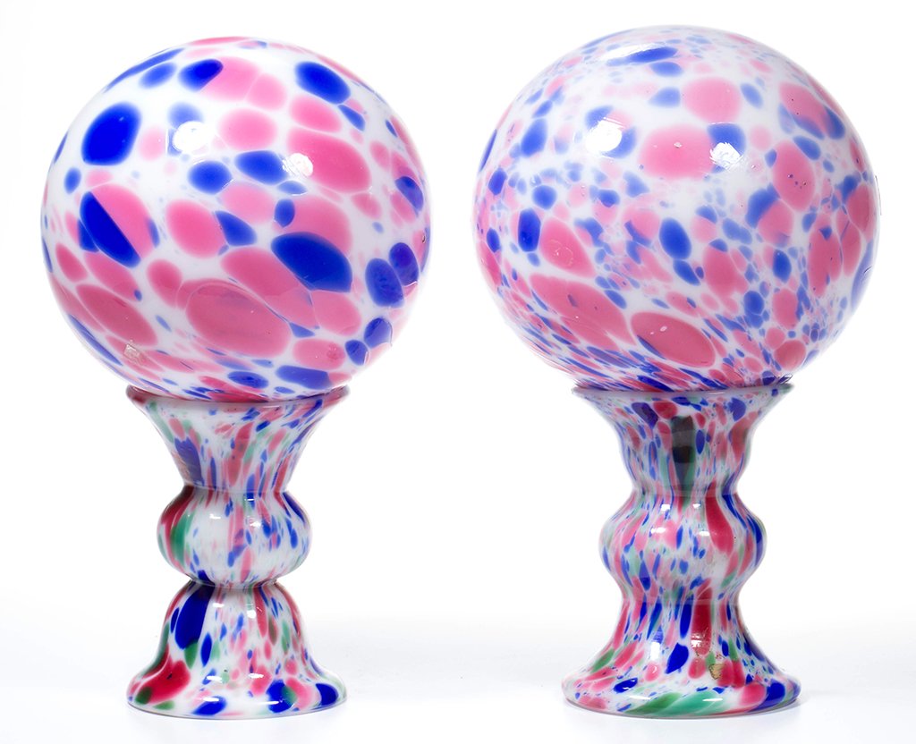 FREE-BLOWN MOTTLED DECORATED NEAR PAIR OF WITCH BALLS: FREE-BLOWN MOTTLED DECORATED NEAR PAIR OF WITCH BALLS WITH RARE STANDS, opal cased colorless with blue and rose, each stand with additional green flakes, open from top to bottom and with medial knop, 